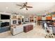 Open concept living room and kitchen offering ample space, fireplace, and modern fixtures at 2285 Villefort Ct, Las Vegas, NV 89117