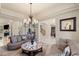 Cozy living room featuring stylish furniture, a chandelier, and an open layout at 2285 Villefort Ct, Las Vegas, NV 89117