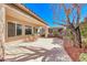 Cozy back patio perfect for dining al fresco with views of the landscaped yard at 2357 Wisconsin Dells Dr, Henderson, NV 89044