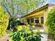 Relax in the backyard oasis with flowering bushes and a covered patio at 2357 Wisconsin Dells Dr, Henderson, NV 89044