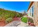 Beautifully landscaped backyard with artificial grass and mature hedges creating a private retreat at 2357 Wisconsin Dells Dr, Henderson, NV 89044