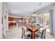 Bright breakfast nook with a square table, sliding door access to the backyard, and open to the kitchen at 2357 Wisconsin Dells Dr, Henderson, NV 89044
