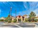Community center entrance with American and community flags, showcasing a welcoming arrival at 2357 Wisconsin Dells Dr, Henderson, NV 89044