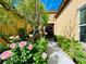 Inviting front entrance featuring lush rose bushes and mature trees at 2357 Wisconsin Dells Dr, Henderson, NV 89044