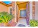 Inviting front entrance with dual doors, a gated entry, and lovely landscaping at 2357 Wisconsin Dells Dr, Henderson, NV 89044