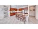 Spacious kitchen with stainless steel appliances, stone countertops, and convenient bar seating at 2357 Wisconsin Dells Dr, Henderson, NV 89044