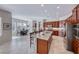 Bright kitchen featuring stainless steel appliances, a large island, and tiled floors at 2357 Wisconsin Dells Dr, Henderson, NV 89044