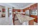 Gourmet kitchen boasts an expansive island with seating, granite countertops, and stainless steel appliances at 2357 Wisconsin Dells Dr, Henderson, NV 89044