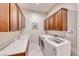Convenient laundry room with a utility sink and lots of cabinet space at 2357 Wisconsin Dells Dr, Henderson, NV 89044
