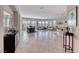 Spacious open-concept living room with large windows and tiled floors offer lots of light at 2357 Wisconsin Dells Dr, Henderson, NV 89044