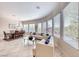 Open living area with dining space features tiled floors, large windows, and stylish decor at 2357 Wisconsin Dells Dr, Henderson, NV 89044