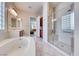 Primary bathroom showcasing soaking tub and tiled walk-in shower at 2357 Wisconsin Dells Dr, Henderson, NV 89044