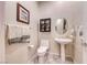 Clean and bright half bath with pedestal sink at 2357 Wisconsin Dells Dr, Henderson, NV 89044