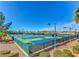 Well-maintained tennis courts surrounded by lush landscaping, offering an active lifestyle at 2357 Wisconsin Dells Dr, Henderson, NV 89044