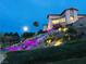 Night view of a beautifully illuminated waterfall and landscape outside of Sun City Anthem at 2357 Wisconsin Dells Dr, Henderson, NV 89044