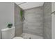 Updated bathroom featuring a stylish tiled shower with plant accents at 2451 N Rainbow Blvd # 1150, Las Vegas, NV 89108