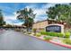 Community entrance sign with manicured landscaping and tree-lined streets at 2451 N Rainbow Blvd # 1150, Las Vegas, NV 89108