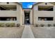 Building exterior featuring a pathway, landscaping and stair access to units at 2451 N Rainbow Blvd # 1150, Las Vegas, NV 89108