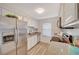 Stylish kitchen featuring granite countertops, stainless steel appliances, and wood-look vinyl flooring for a modern touch at 2451 N Rainbow Blvd # 1150, Las Vegas, NV 89108