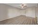 Spacious living room features neutral paint and wood-look vinyl floors at 2451 N Rainbow Blvd # 1150, Las Vegas, NV 89108