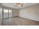 Bright living room with vinyl plank flooring and a sliding glass door at 2451 N Rainbow Blvd # 1150, Las Vegas, NV 89108