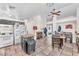 Open-concept kitchen and dining area featuring tile floors, ample counter space, and a cozy fireplace at 2459 Avenida Cataluna, Henderson, NV 89074