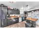 Functional kitchen with black cabinetry, tile flooring, and efficient layout perfect for cooking at 2459 Avenida Cataluna, Henderson, NV 89074