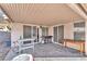 A covered patio area with sliding glass doors and a grill for outdoor cooking and entertaining at 2459 Avenida Cataluna, Henderson, NV 89074