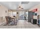 Bright dining area with tile floors, a ceiling fan, and sliding glass doors to the backyard at 2526 Begonia Valley Ave, Henderson, NV 89074