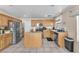 Modern kitchen with stainless steel appliances, island and light wood cabinetry at 2526 Begonia Valley Ave, Henderson, NV 89074