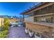 Backyard oasis with a refreshing pool and a covered patio featuring a bar and dining area for outdoor entertaining at 2641 Via Monet, Henderson, NV 89044