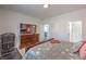 This bedroom features a TV, dresser, and doorway leading to the bathroom and walk in closet at 2641 Via Monet, Henderson, NV 89044