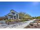 Contemporary two-story home with desert landscaping and a walkway leading to the entrance at 2641 Via Monet, Henderson, NV 89044