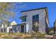 Modern home with a mix of white and gray exterior and well-maintained desert landscaping at 2641 Via Monet, Henderson, NV 89044