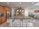 Stylish kitchen island with granite countertops, stainless appliances, and a dining area at 2641 Via Monet, Henderson, NV 89044