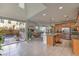 Spacious kitchen with island, stainless steel appliances, and sliding doors to the outdoor patio and living area at 2641 Via Monet, Henderson, NV 89044