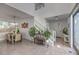 Open-concept living space with staircase, dining area, and abundant natural light at 2641 Via Monet, Henderson, NV 89044