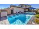 Backyard pool and spa with tiled accents, a patio area, and privacy fencing at 2641 Via Monet, Henderson, NV 89044