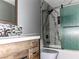 Stylish bathroom featuring marble-patterned tile in shower and modern vanity with decorative tile backsplash at 2720 Beaver Creek Ct # 202, Las Vegas, NV 89117