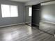 Bedroom featuring spacious closet space, a window, and new wood flooring at 2720 Beaver Creek Ct # 202, Las Vegas, NV 89117