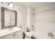 Bathroom featuring a shower-tub combo and a vanity with a framed mirror at 275 N Lamb Blvd # E, Las Vegas, NV 89110