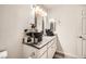 Bathroom featuring a toilet and vanity with decorative countertop, and an framed mirror at 275 N Lamb Blvd # E, Las Vegas, NV 89110