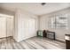 Bedroom with closet, a large window and wood-look laminate flooring at 275 N Lamb Blvd # E, Las Vegas, NV 89110