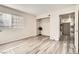 Bedroom featuring wood-look flooring, closet space, and a window at 275 N Lamb Blvd # E, Las Vegas, NV 89110