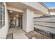 Cozy covered entryway featuring seating area and secure gated door with textured walls at 275 N Lamb Blvd # E, Las Vegas, NV 89110