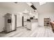 Modern kitchen with stainless steel appliances, white cabinets and island with breakfast bar at 275 N Lamb Blvd # E, Las Vegas, NV 89110