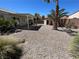 The desert landscape is completed with a backyard shed and privacy walls, adding storage and defining the outdoor space at 3118 Honeysuckle Ave, North Las Vegas, NV 89031