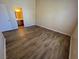 Bedroom view showcases plank flooring and an open doorway to the bathroom at 3118 Honeysuckle Ave, North Las Vegas, NV 89031