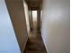 Hallway with plank floors and neutral walls at 3118 Honeysuckle Ave, North Las Vegas, NV 89031