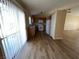 Bright kitchen features wood cabinets, white appliances, and plank flooring at 3118 Honeysuckle Ave, North Las Vegas, NV 89031